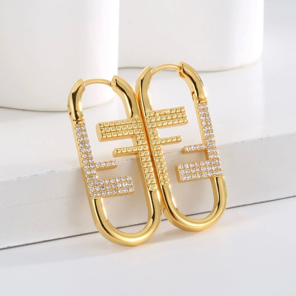 Gold fendi earring